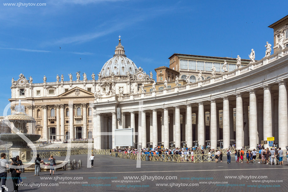 ROME, ITALY - JUNE 23, 2017: Tourists visit Saint Peter"s Square and St. Peter"s Basilica in Rome, Vatican, Italy