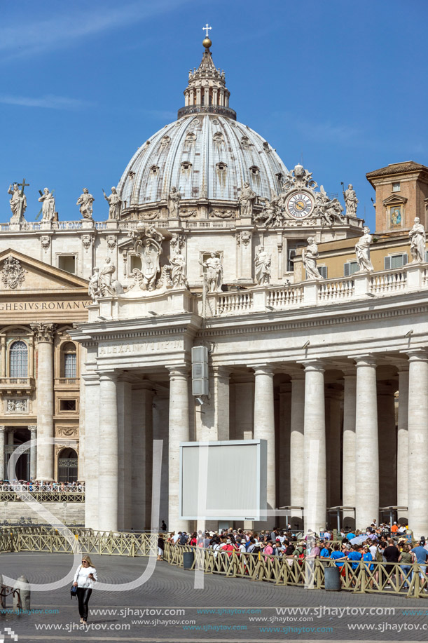 ROME, ITALY - JUNE 23, 2017: Tourists visit Saint Peter"s Square and St. Peter"s Basilica in Rome, Vatican, Italy