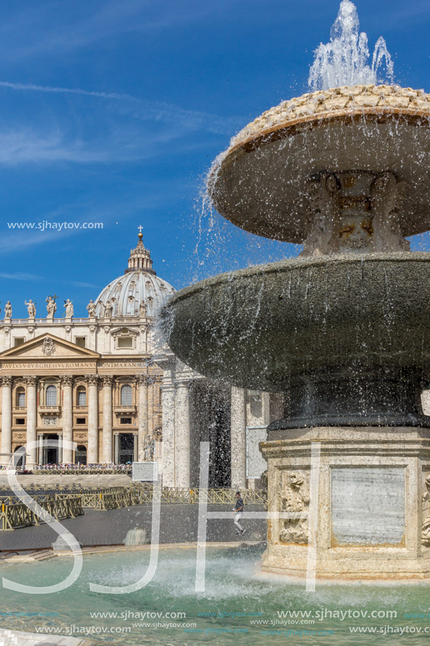 ROME, ITALY - JUNE 23, 2017: Tourists visit Saint Peter"s Square and St. Peter"s Basilica in Rome, Vatican, Italy