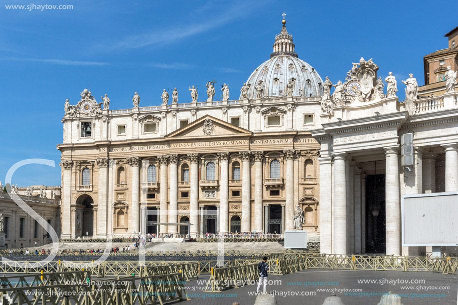 ROME, ITALY - JUNE 23, 2017: Tourists visit Saint Peter"s Square and St. Peter"s Basilica in Rome, Vatican, Italy