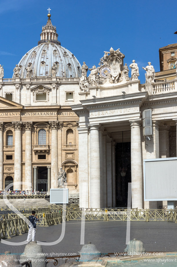 ROME, ITALY - JUNE 23, 2017: Tourists visit Saint Peter"s Square and St. Peter"s Basilica in Rome, Vatican, Italy