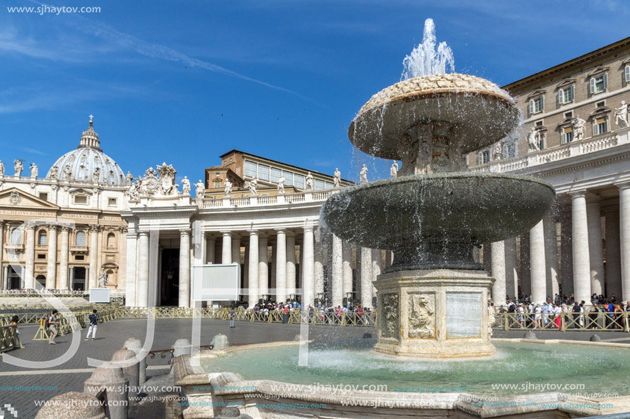 ROME, ITALY - JUNE 23, 2017: Tourists visit Saint Peter"s Square and St. Peter"s Basilica in Rome, Vatican, Italy