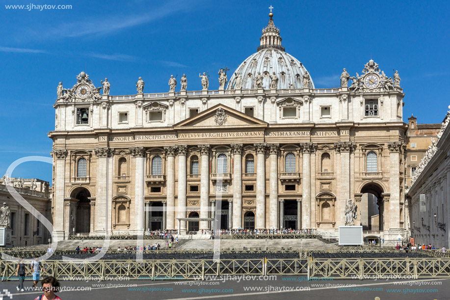 ROME, ITALY - JUNE 23, 2017: Tourists visit Saint Peter"s Square and St. Peter"s Basilica in Rome, Vatican, Italy