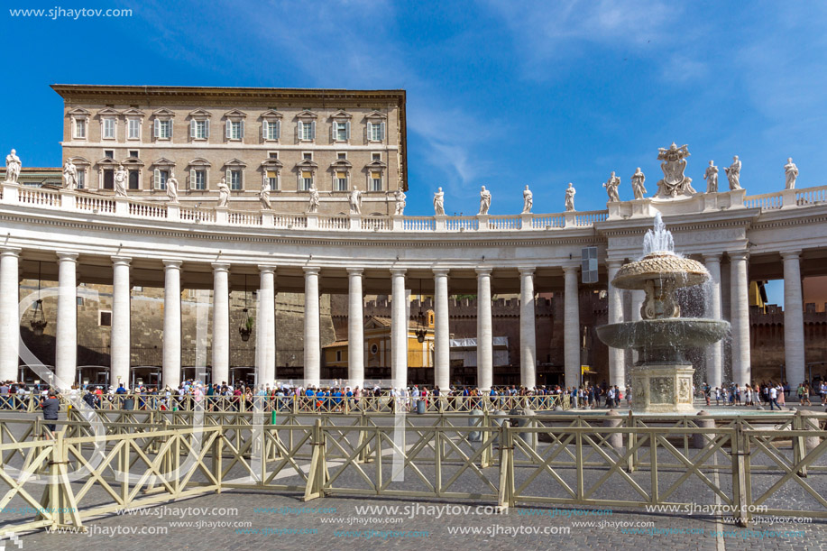 ROME, ITALY - JUNE 23, 2017: Tourists visit Saint Peter"s Square and St. Peter"s Basilica in Rome, Vatican, Italy