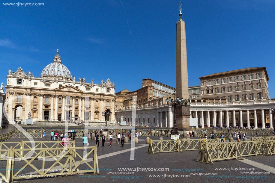 ROME, ITALY - JUNE 23, 2017: Tourists visit Saint Peter"s Square and St. Peter"s Basilica in Rome, Vatican, Italy