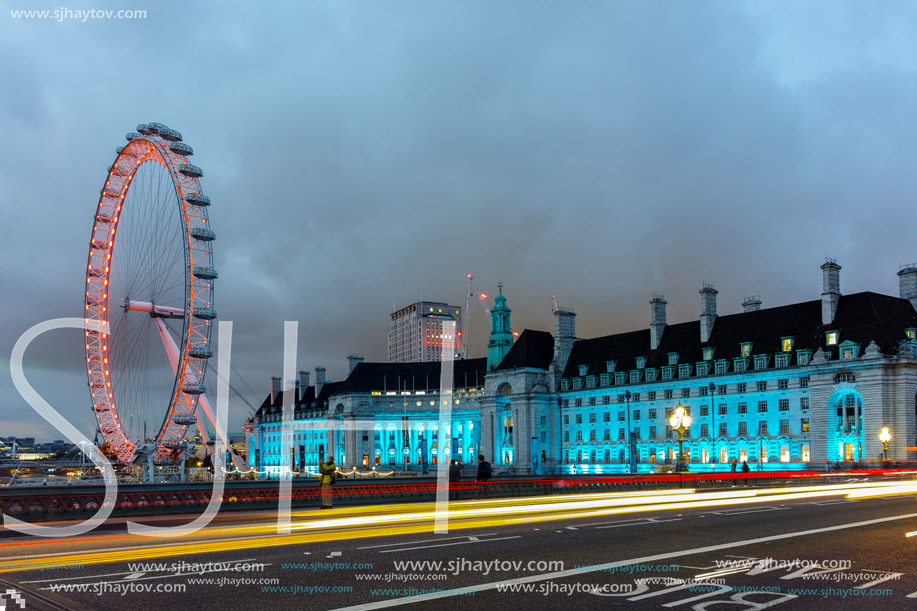 LONDON, ENGLAND - JUNE 16 2016: Night photo of The London Eye and County Hall from Westminster bridge, London, England, Great Britain