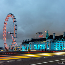 LONDON, ENGLAND - JUNE 16 2016: Night photo of The London Eye and County Hall from Westminster bridge, London, England, Great Britain