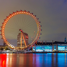 LONDON, ENGLAND - JUNE 16 2016: Night photo of The London Eye and County Hall from Westminster bridge, London, England, Great Britain