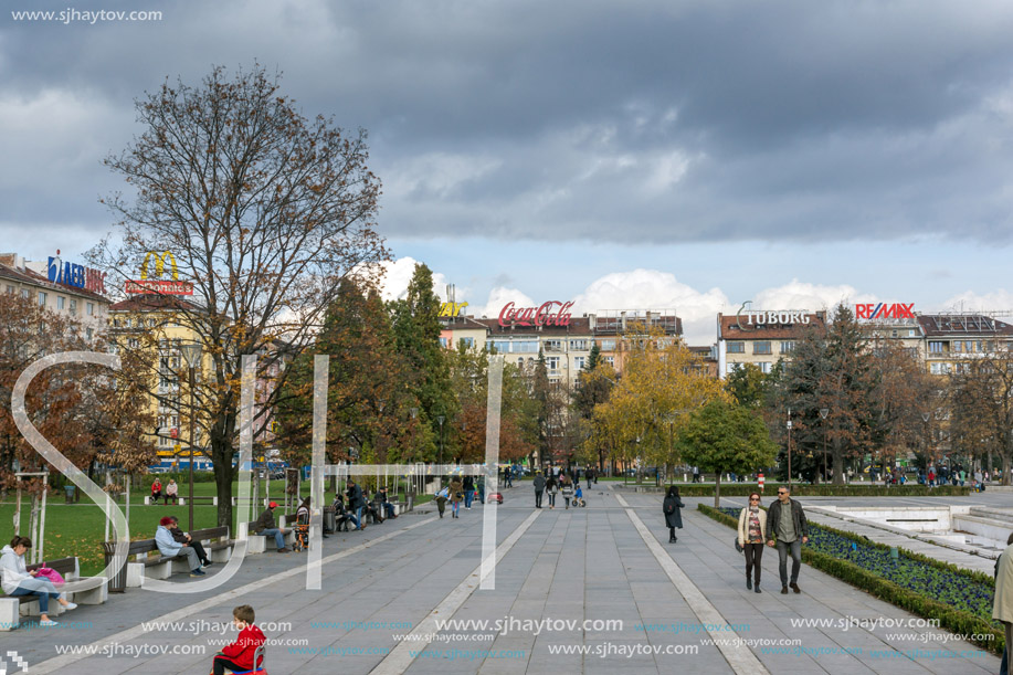 SOFIA, BULGARIA -NOVEMBER 12, 2017: Walking people on park in front of  National Palace of Culture in Sofia, Bulgaria