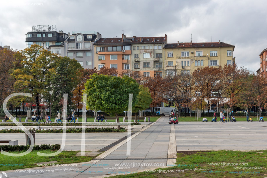 SOFIA, BULGARIA -NOVEMBER 12, 2017: Walking people on park in front of  National Palace of Culture in Sofia, Bulgaria