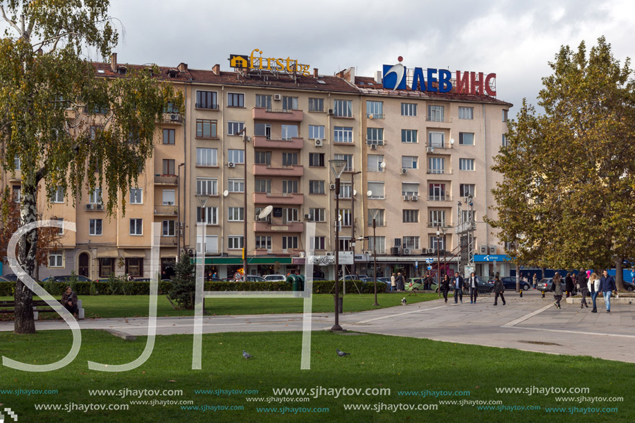 SOFIA, BULGARIA -NOVEMBER 12, 2017: Walking people on park in front of  National Palace of Culture in Sofia, Bulgaria