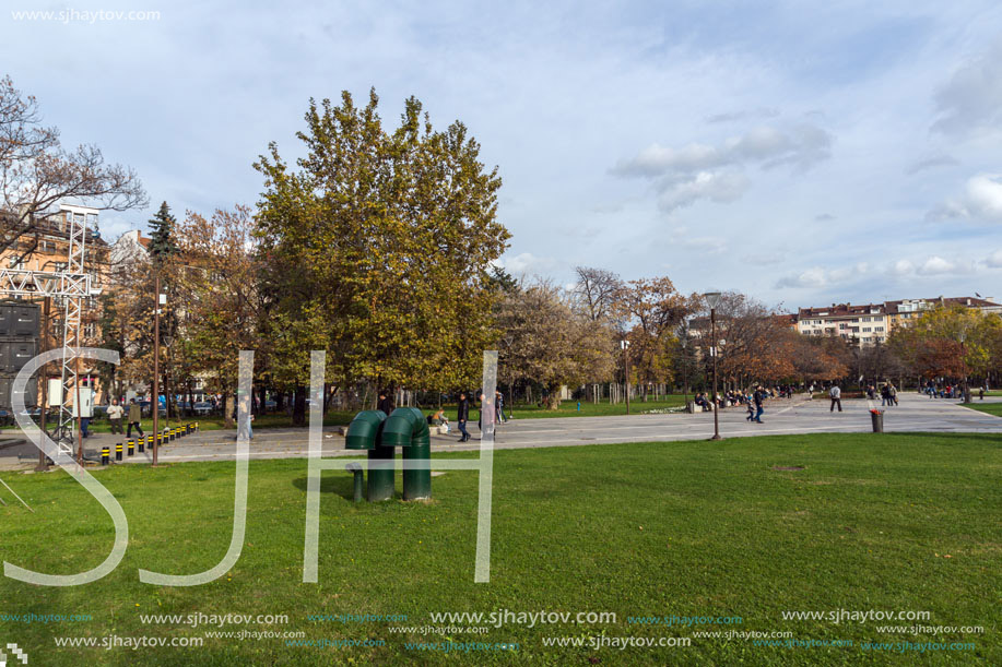 SOFIA, BULGARIA - NOVEMBER 12, 2017: Walking people on park in front of  National Palace of Culture in Sofia, Bulgaria
