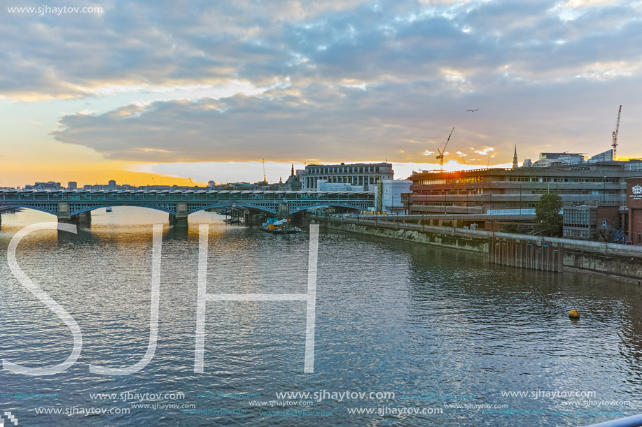 LONDON, ENGLAND - JUNE 18, 2016: Amazing sunset Cityscape from Millennium Bridge and Thames River, London, Great Britain