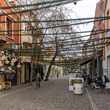 PLOVDIV, BULGARIA - DECEMBER 30, 2016:  Walking people and Street in district Kapana, city of Plovdiv, Bulgaria