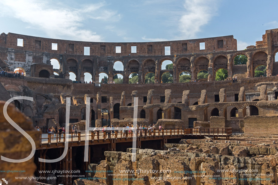 ROME, ITALY - JUNE 24, 2017: Tourists visiting inside part of  Colosseum in city of Rome, Italy
