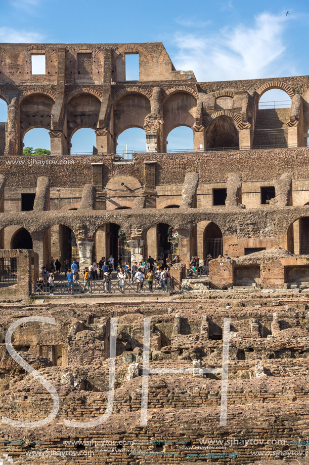 ROME, ITALY - JUNE 24, 2017: Tourists visiting inside part of  Colosseum in city of Rome, Italy