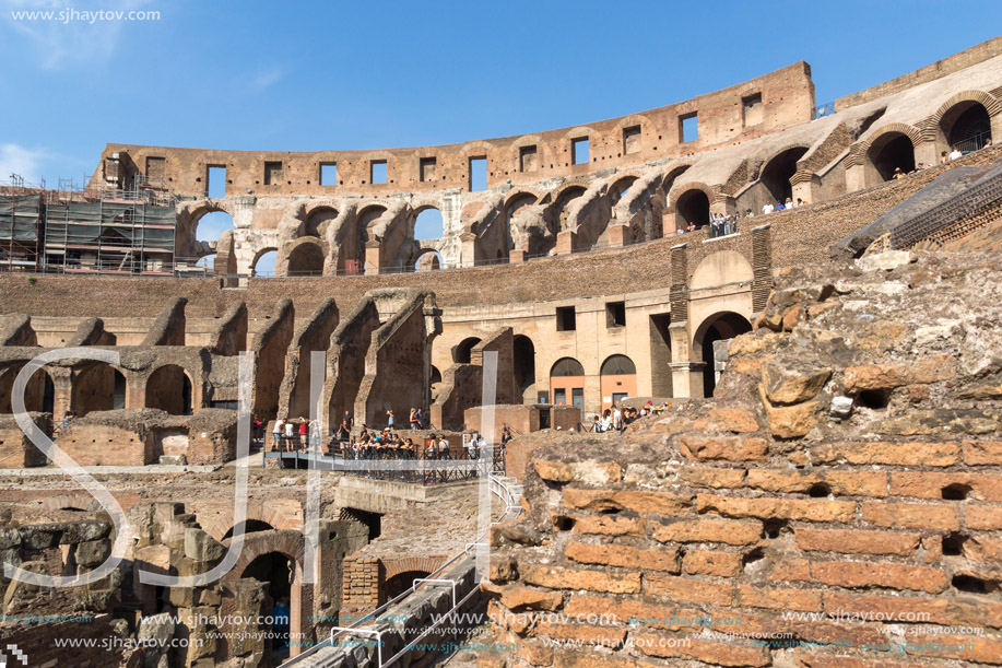 ROME, ITALY - JUNE 24, 2017: Tourists visiting inside part of  Colosseum in city of Rome, Italy