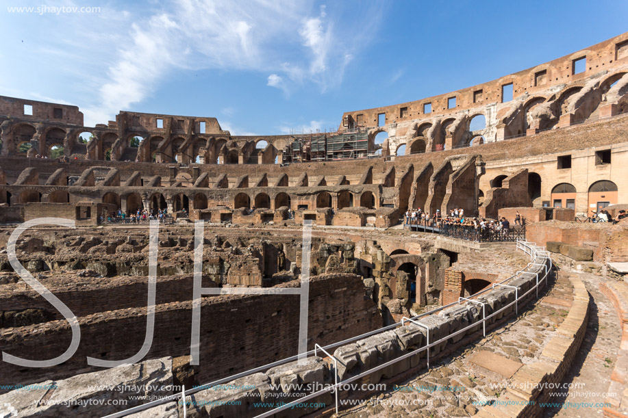 ROME, ITALY - JUNE 24, 2017: Tourists visiting inside part of  Colosseum in city of Rome, Italy
