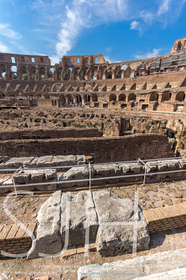 ROME, ITALY - JUNE 24, 2017: Tourists visiting inside part of  Colosseum in city of Rome, Italy