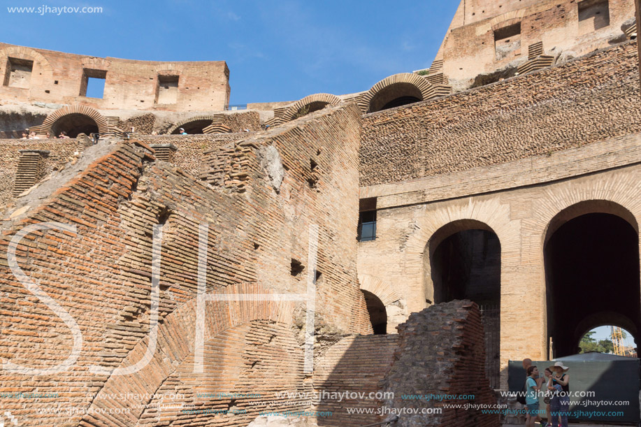 ROME, ITALY - JUNE 24, 2017: Tourists visiting inside part of  Colosseum in city of Rome, Italy