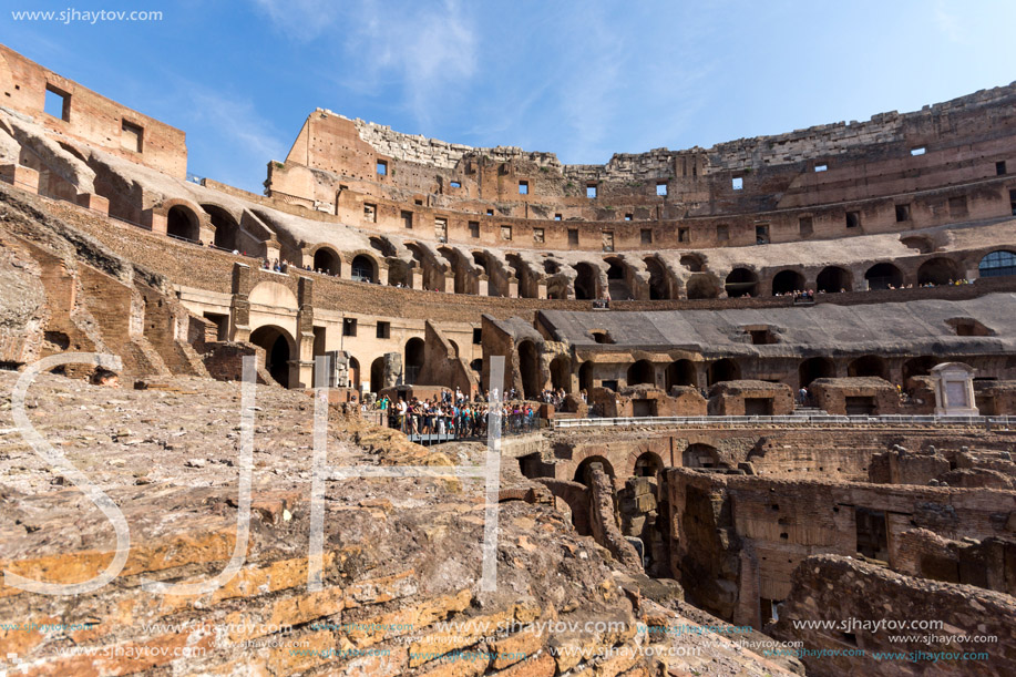 ROME, ITALY - JUNE 24, 2017: Tourists visiting inside part of  Colosseum in city of Rome, Italy