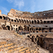 ROME, ITALY - JUNE 24, 2017: Tourists visiting inside part of  Colosseum in city of Rome, Italy