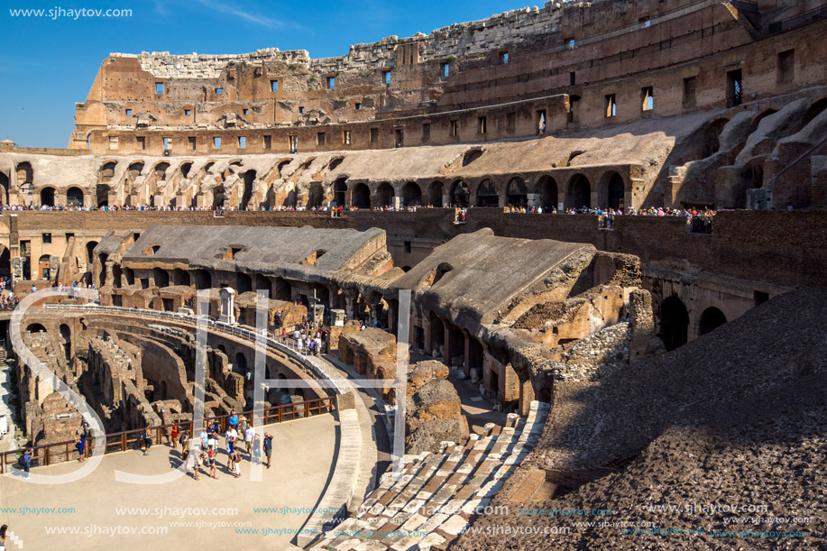 ROME, ITALY - JUNE 24, 2017: Tourists visiting inside part of  Colosseum in city of Rome, Italy