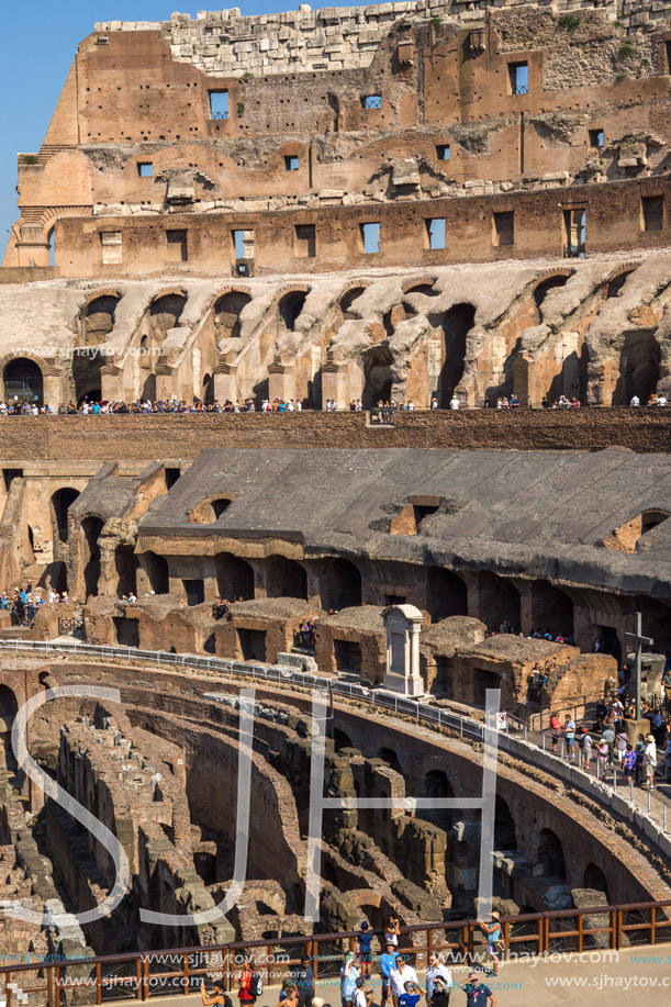 ROME, ITALY - JUNE 24, 2017: Tourists visiting inside part of  Colosseum in city of Rome, Italy