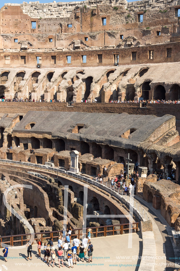 ROME, ITALY - JUNE 24, 2017: Tourists visiting inside part of  Colosseum in city of Rome, Italy