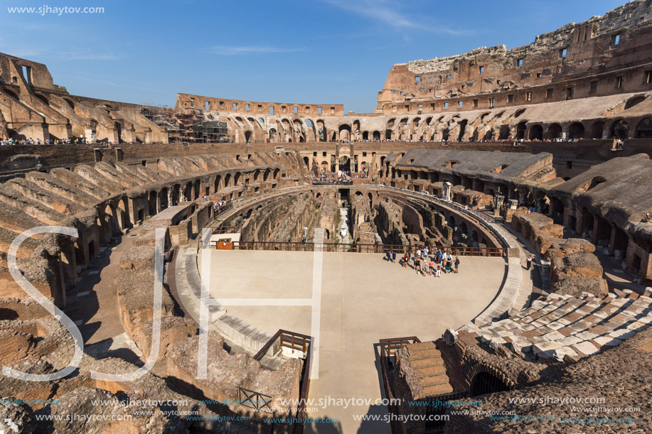ROME, ITALY - JUNE 24, 2017: Tourists visiting inside part of  Colosseum in city of Rome, Italy