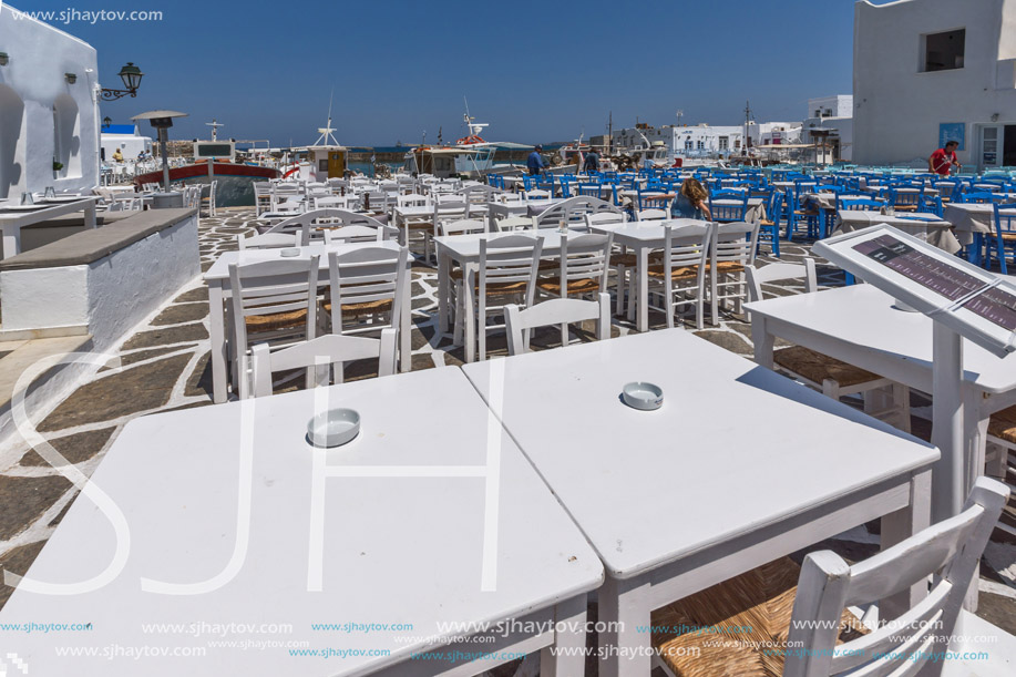 PAROS, GREECE - MAY 3, 2013: Old white house and Bay in Naoussa town, Paros island, Cyclades, Greece