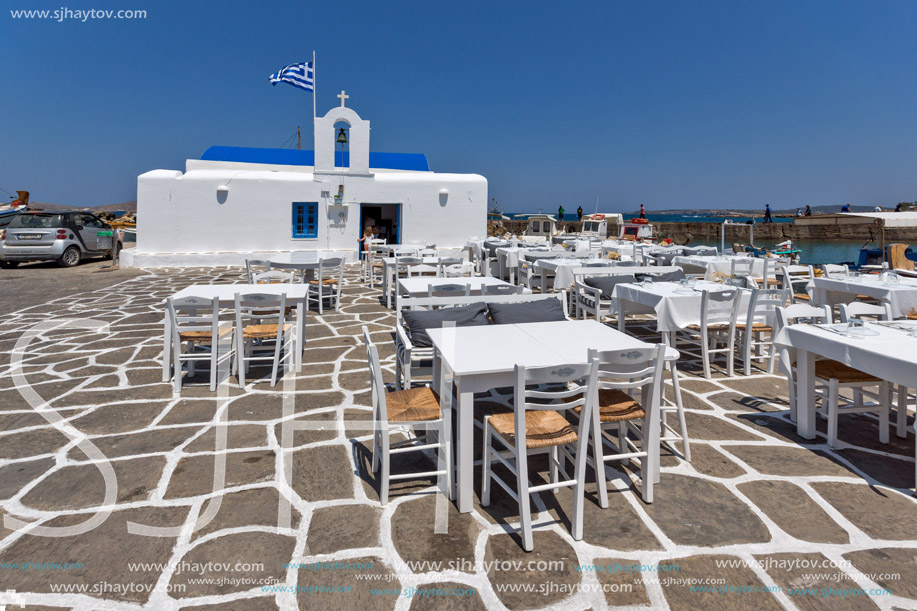 PAROS, GREECE - MAY 3, 2013: Old white house and Bay in Naoussa town, Paros island, Cyclades, Greece