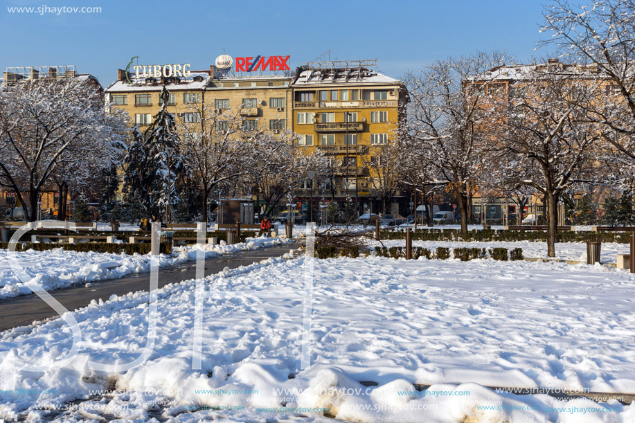 SOFIA, BULGARIA - NOVEMBER 29, 2017: Winter view of Walking people on park in front of  National Palace of Culture in Sofia, Bulgaria