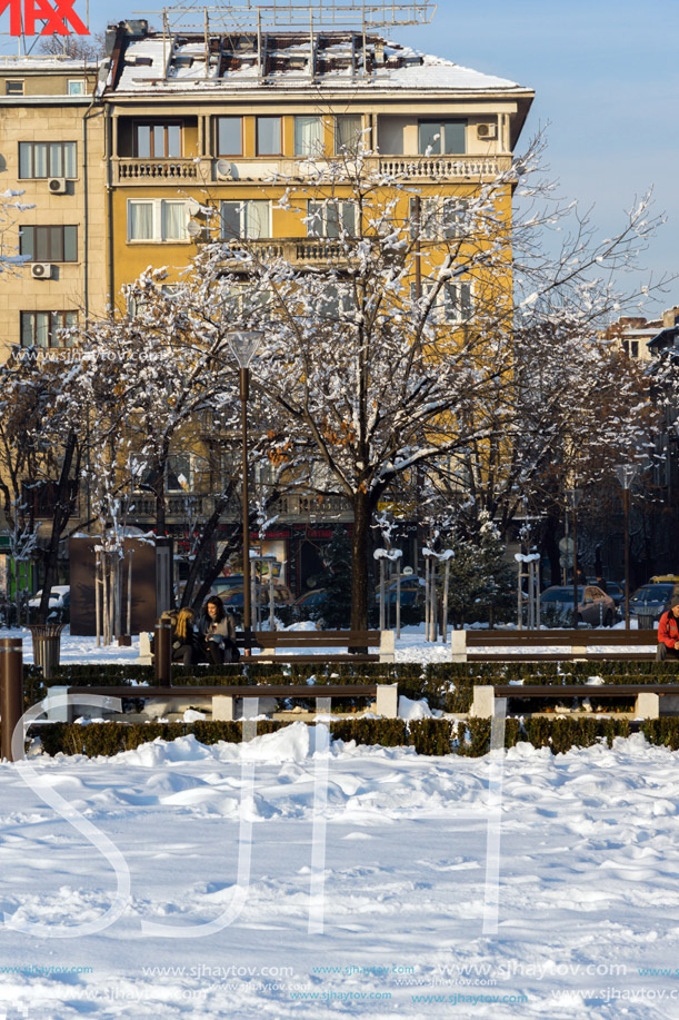 SOFIA, BULGARIA - NOVEMBER 29, 2017: Winter view of Walking people on park in front of  National Palace of Culture in Sofia, Bulgaria