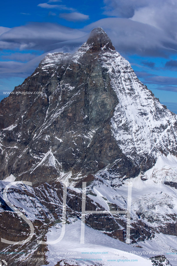 Winter panorama of mount Matterhorn covered with clouds, Canton of Valais, Alps, Switzerland