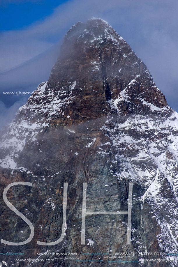 Winter panorama of mount Matterhorn covered with clouds, Canton of Valais, Alps, Switzerland