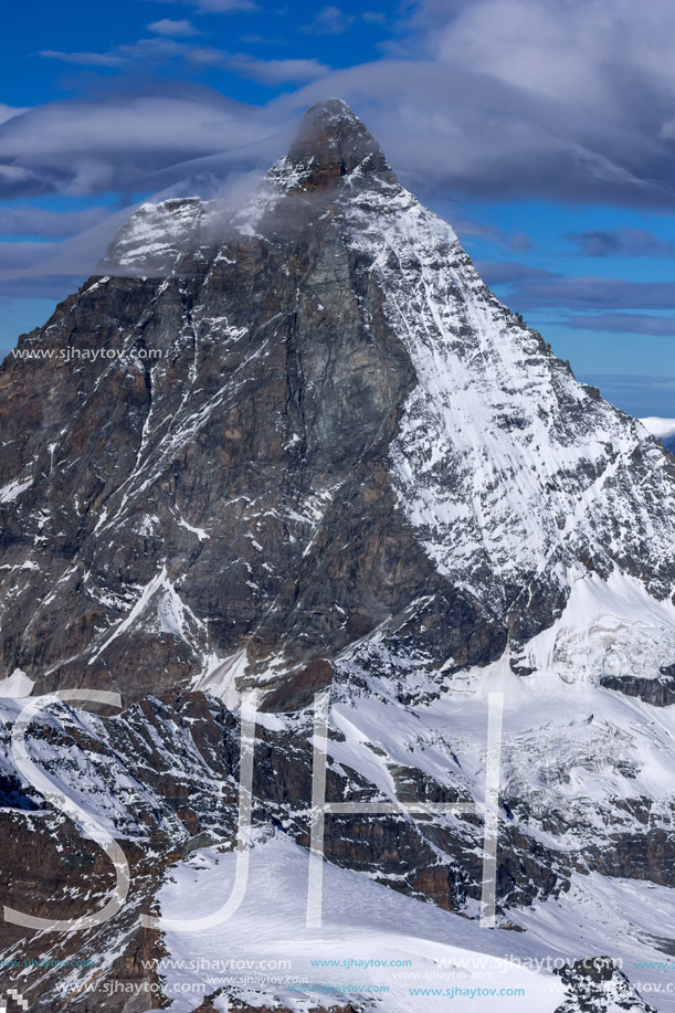 Winter panorama of mount Matterhorn covered with clouds, Canton of Valais, Alps, Switzerland