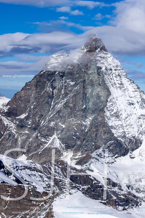 Winter panorama of mount Matterhorn covered with clouds, Canton of Valais, Alps, Switzerland