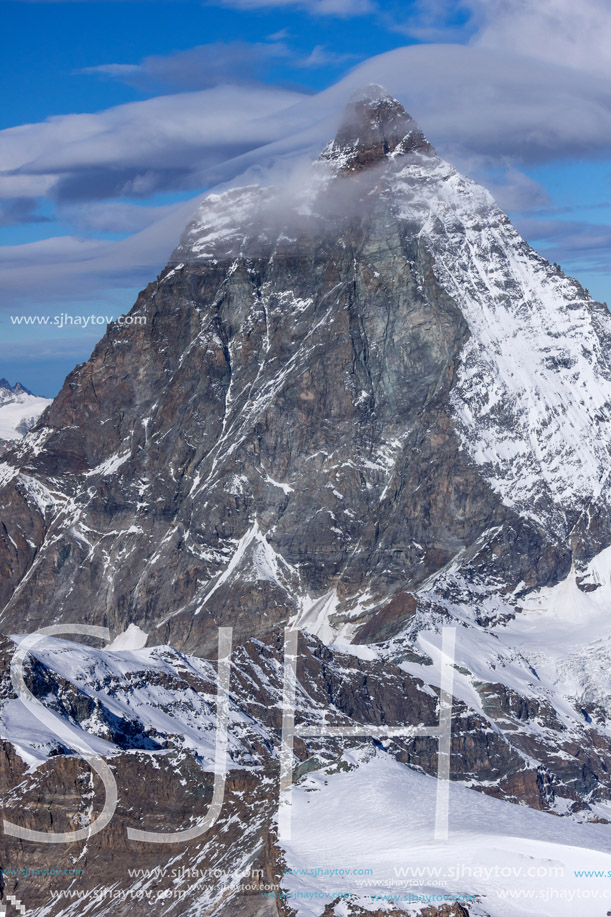 Winter panorama of mount Matterhorn covered with clouds, Canton of Valais, Alps, Switzerland