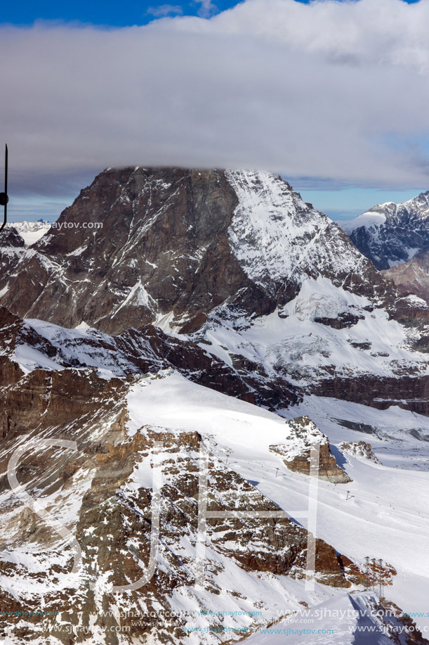 Winter panorama of mount Matterhorn covered with clouds, Canton of Valais, Alps, Switzerland