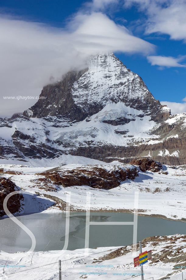 Winter panorama of mount Matterhorn covered with clouds, Canton of Valais, Alps, Switzerland