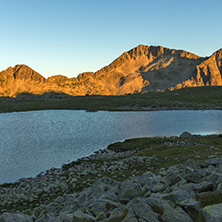 Sunset landscape with Kamenitsa peak and Tevno lake, Pirin Mountain, Bulgaria