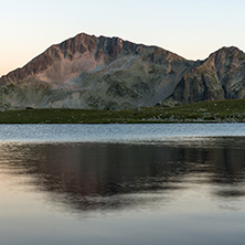 Sunset landscape with Kamenitsa peak and Tevno lake, Pirin Mountain, Bulgaria