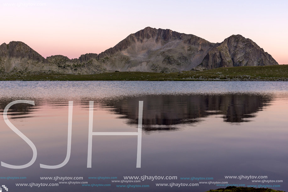 Sunset landscape with Kamenitsa peak and Tevno lake, Pirin Mountain, Bulgaria