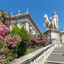 ROME, ITALY - JUNE 23, 2017: Statue and Flowers in front of Capitoline Museums in city of Rome, Italy