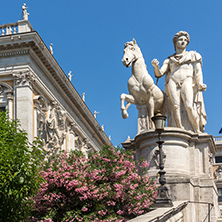 ROME, ITALY - JUNE 23, 2017: Statue and Flowers in front of Capitoline Museums in city of Rome, Italy