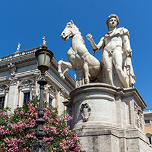 ROME, ITALY - JUNE 23, 2017: Statue and Flowers in front of Capitoline Museums in city of Rome, Italy