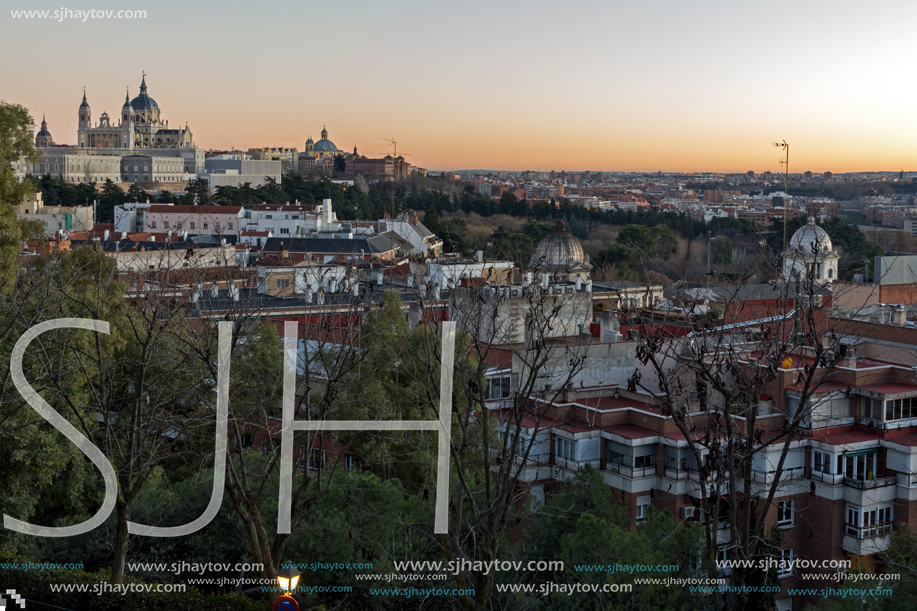 MADRID, SPAIN - JANUARY 21, 2018:  Sunset view of Royal Palace and Almudena Cathedral in City of Madrid, Spain