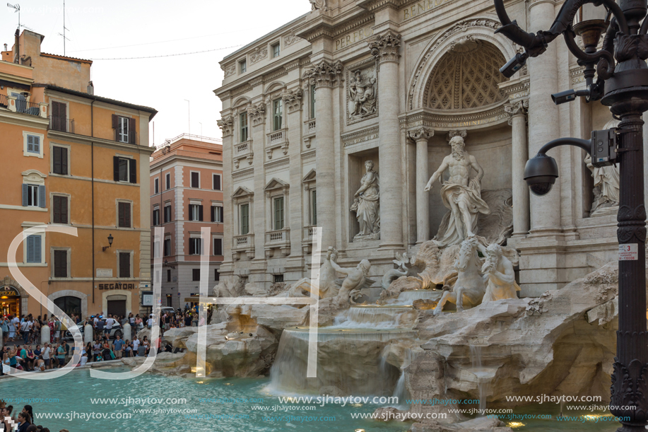 ROME, ITALY - JUNE 24, 2017: Sunset view of People visiting Trevi Fountain (Fontana di Trevi) in city of Rome, Italy