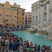 ROME, ITALY - JUNE 24, 2017: Sunset view of People visiting Trevi Fountain (Fontana di Trevi) in city of Rome, Italy